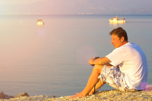 Brandon while bird watching by the shore