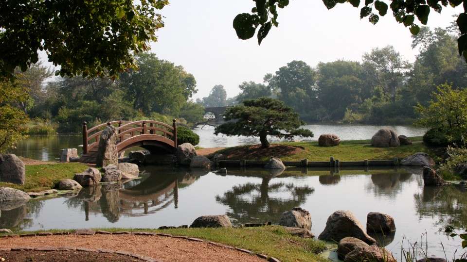 Illinois Jackson Park, Chicago Scene of water through an ornamental garden and small bridge.