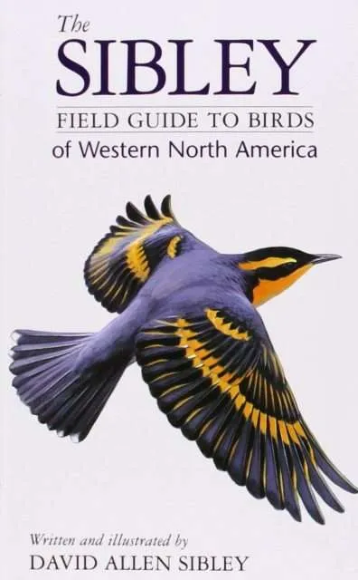 A bird guide book with a dark bird on the cover.